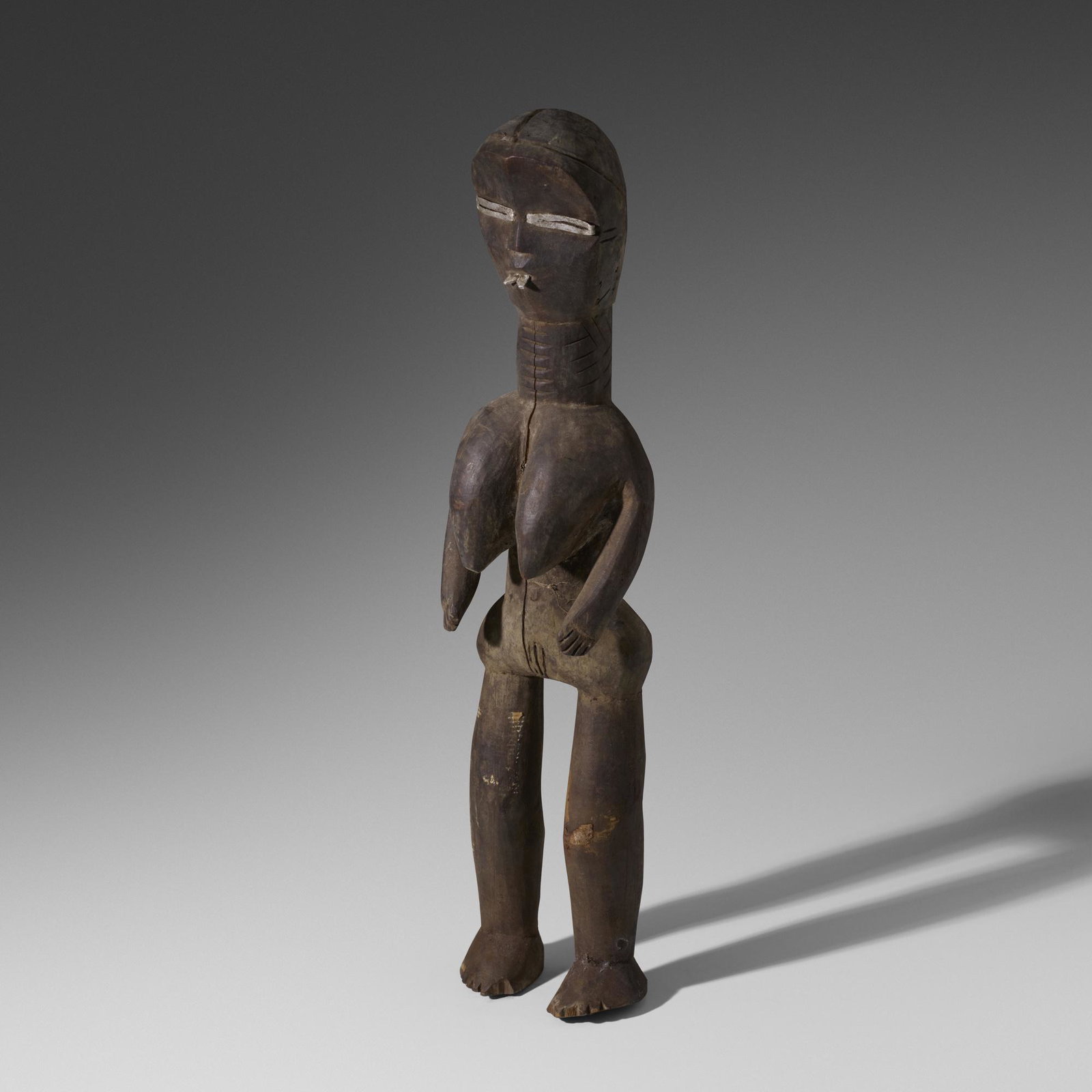 Dan artist, Lu Me figure: Dan artist Lu Me figure Liberia/Cote d'Ivoire, 20th Century carved wood, aluminum 25 h × 6 w × 5.5 d in (63 × 15 × 14 cm) Provenance: Collection of Mark Isa