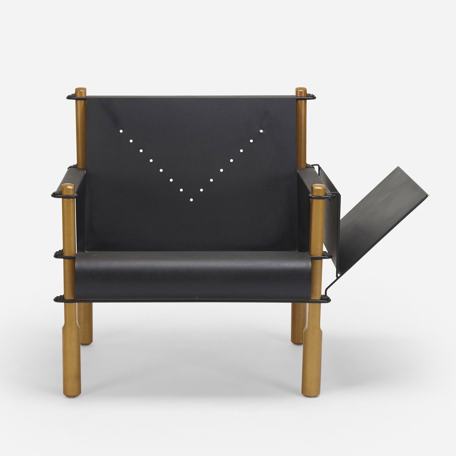 American, lounge chair with magazine rack: American lounge chair with magazine rack c. 2010enameled steel, beech, rubber30 h × 38 w × 28 d in (76 × 97 × 71 cm) Chair features a removable left or right mounted magaz