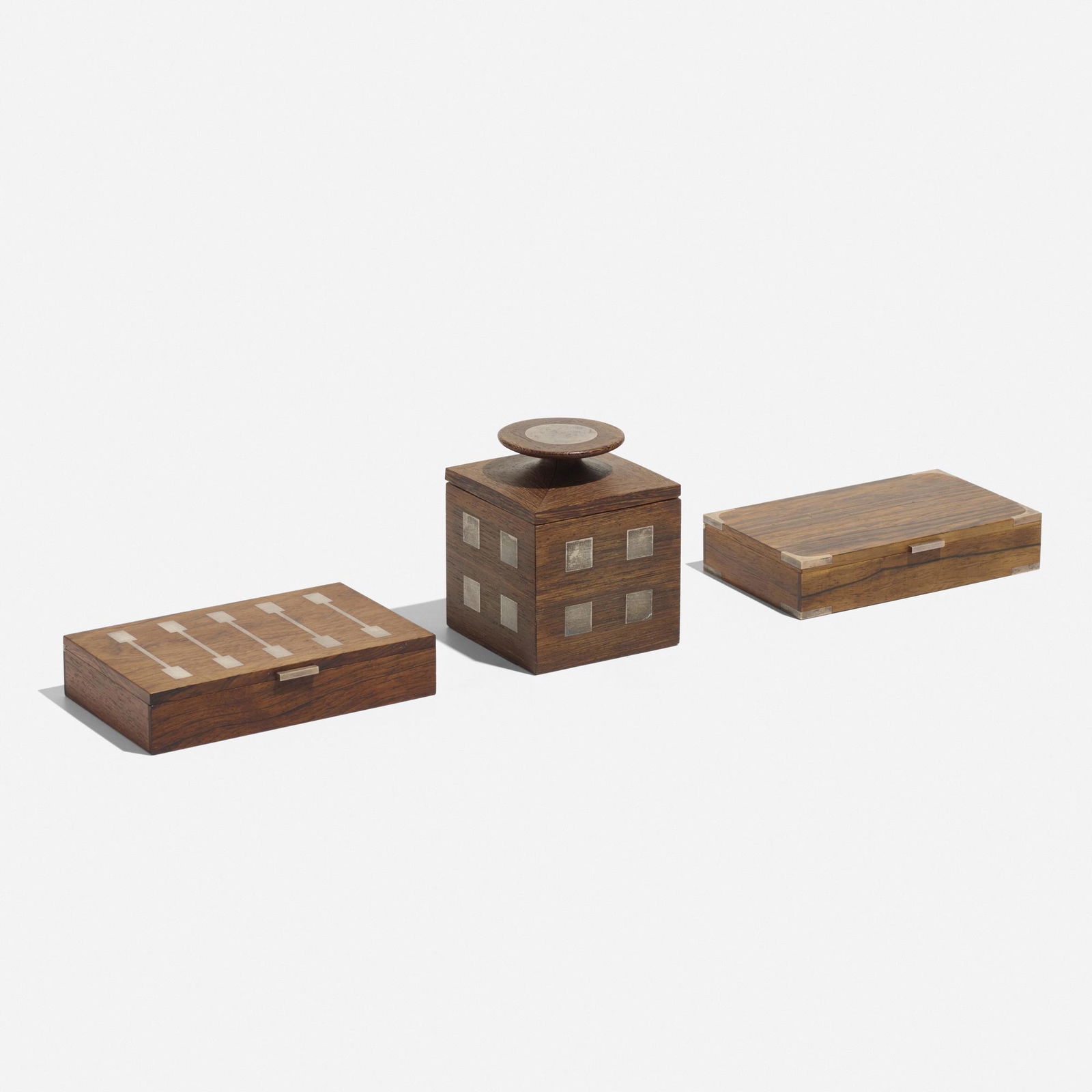 Hans Hansen, boxes, set of three: Hans Hansen boxes, set of three Georg Jensenc. 1955wenge, rosewood, sterling silver4.75 h × 4 w × 4 d in (12 × 10 × 10 cm) Additional examples measure: 1.5 h x 7 w x