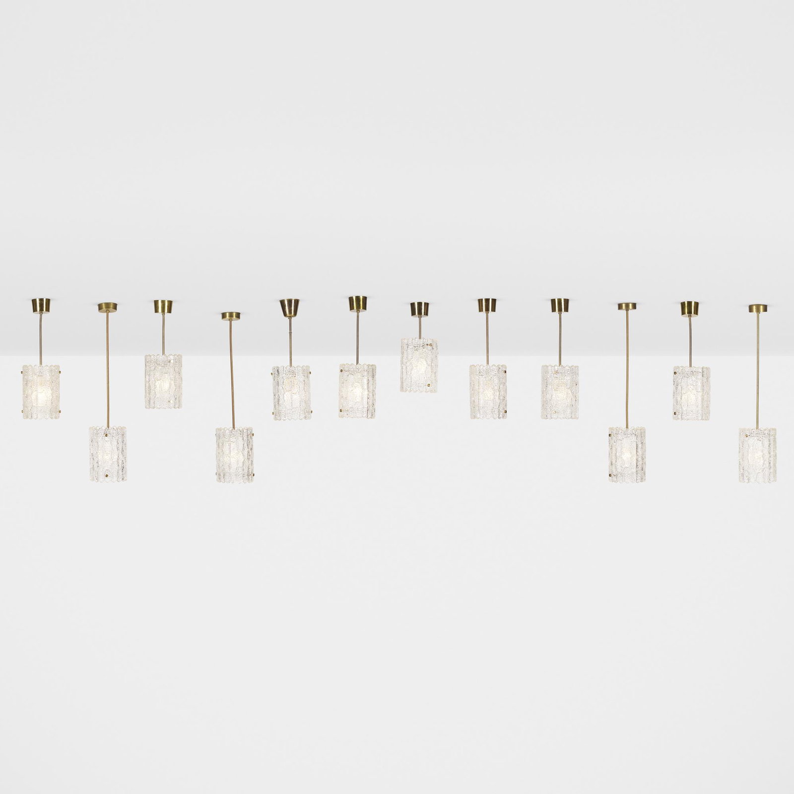 Luxus, pendant lamps, set of twelve: Luxus pendant lamps, set of twelve Sweden, c. 1970 glass, brass 7 dia × 32 h in (18 × 81 cm) Nine examples measure: 7 dia x 18.75 h inches.