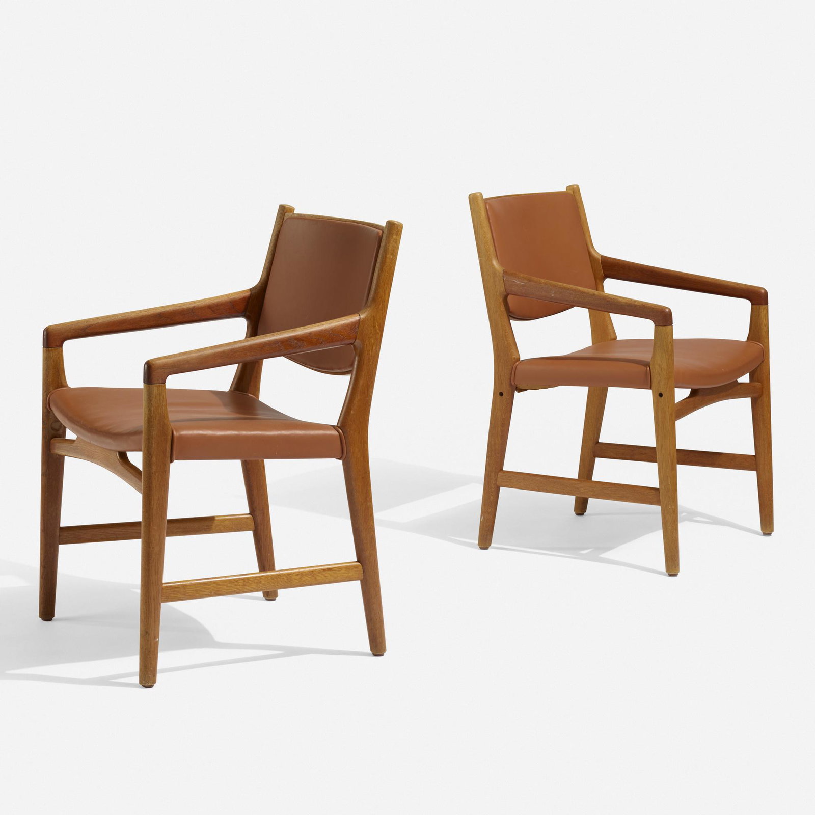 Hans J. Wegner, armchairs from Magasin du Nord, pair: Hans J. Wegner armchairs from Magasin du Nord, pair Johannes Hansen Denmark, c. 1950 oak, leather 23.5 w × 22.5 d × 32.75 h in (60 × 57 × 83 cm) This design was custom-