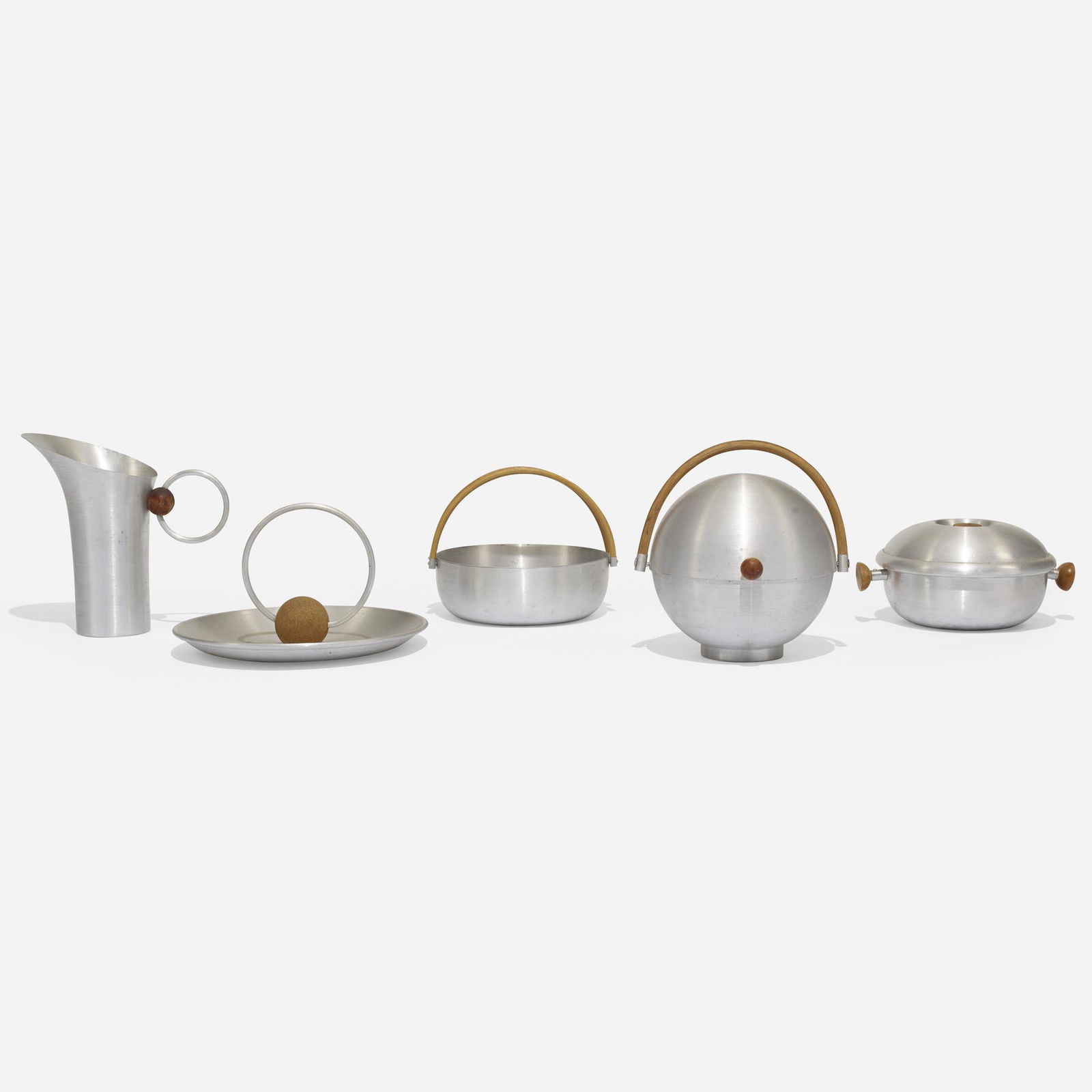 Russel Wright, collection of five serving pieces: Russel Wright collection of five serving pieces Russel Wright, Inc.USA, c. 1935spun aluminum, bamboo, birch, cork6 w × 10.25 d × 10.25 h in (15 × 26 × 26 cm) Collect