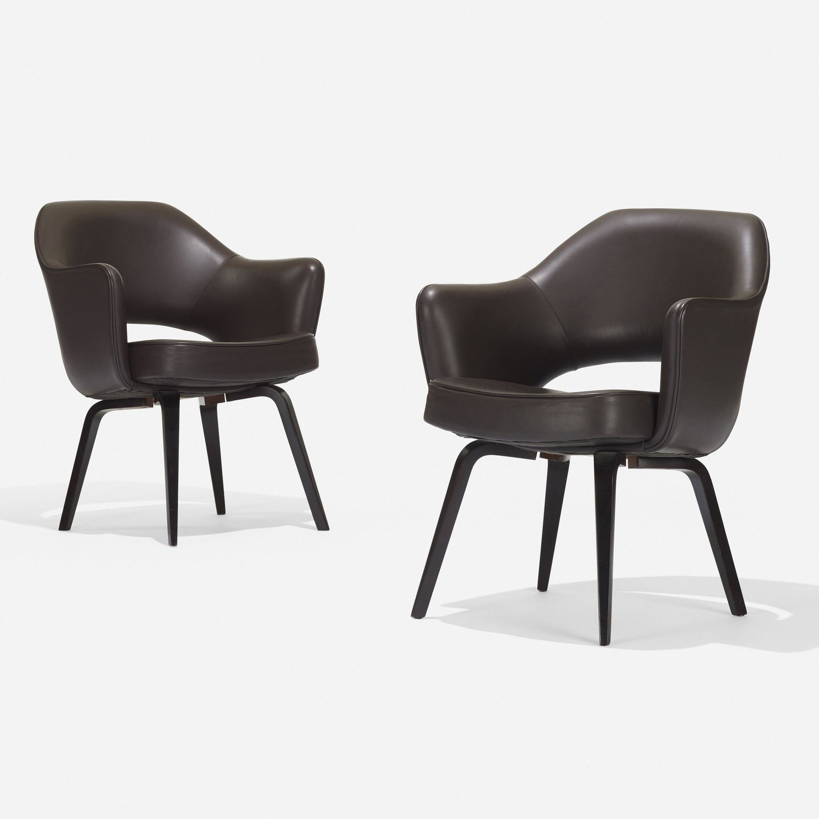 Eero Saarinen, armchairs model 71, pair: Eero Saarinen armchairs model 71, pair Knoll USA, 1948 / c. 1965 leather, lacquered wood 24.75 w × 25 d × 30.25 h in (63 × 63 × 77 cm) Paper manufacturer's label to und