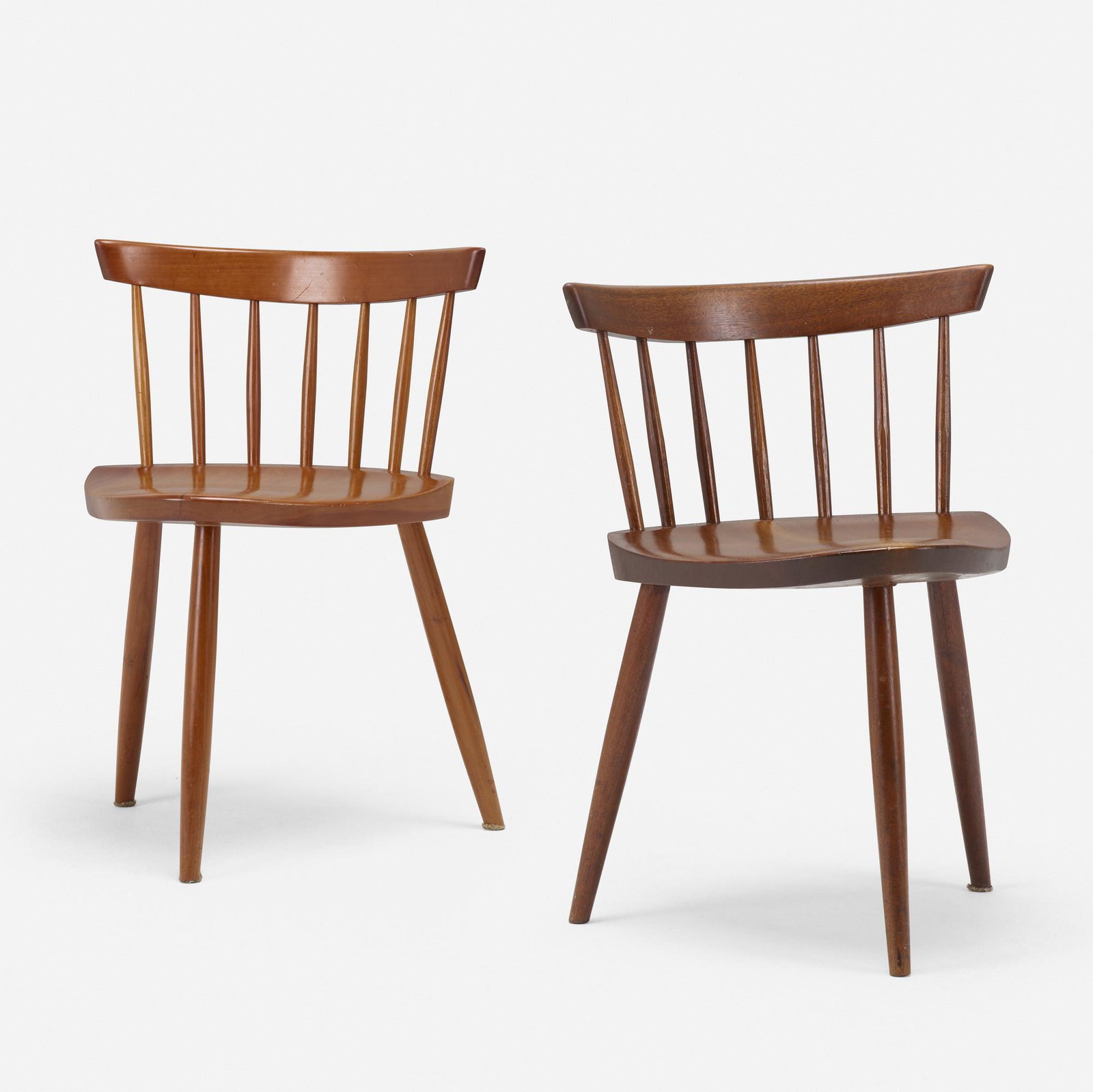 George Nakashima, Mira chairs, set of two: George Nakashima Mira chairs, set of two Nakashima Studio USA, 1961, 1984 American black walnut, cherry 27 h × 17 w × 16.5 d in (69 × 43 × 42 cm) Signed to underside of