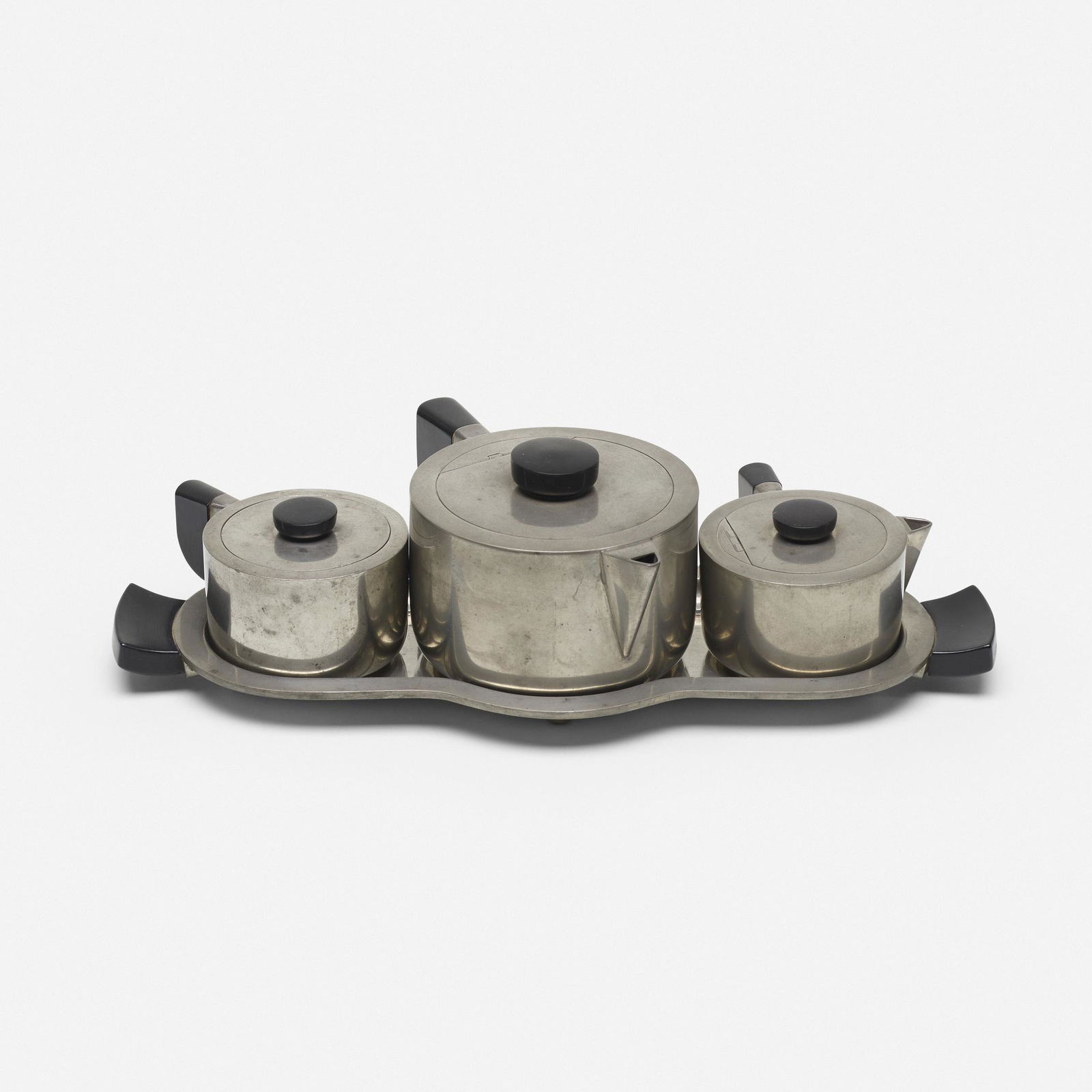 Virginia Hamill, tea set: Virginia Hamill tea set Wilcox Silver Plate Co.USA, c. 1928pewter, Bakelite13.5 w × 7 d × 4 h in (34 × 18 × 10 cm) Set includes teapot, creamer, sugar bowl and tray.