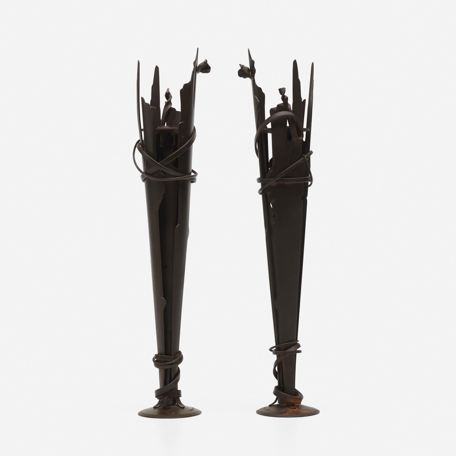 Albert Paley, Vulcan Candleholders, pair: Albert Paley Vulcan Candleholders, pair USA, 1994formed and fabricated steel20.25 h × 4.5 dia in (51 × 11 cm) Impressed signature and date to base of each example 'Albert Paley 1994'.