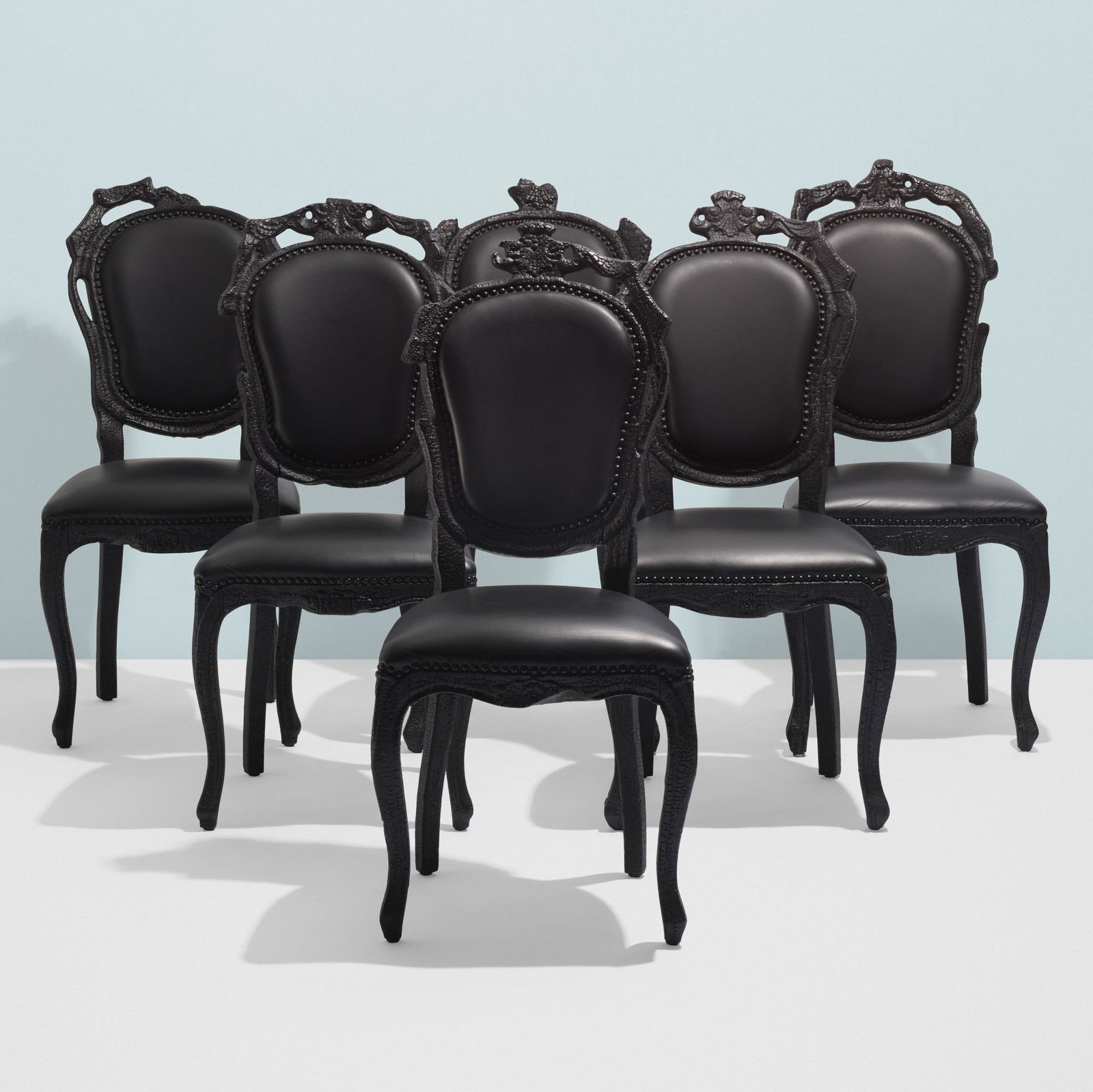 Maarten Baas, Smoke dining chairs, set of six: Maarten Baas Smoke dining chairs, set of six MoooiThe Netherlands, 2002burned and lacquered wood, leather17.25 w × 22.5 d × 41.25 h in (44 × 57 × 105 cm) Metal manufacturer's label to under