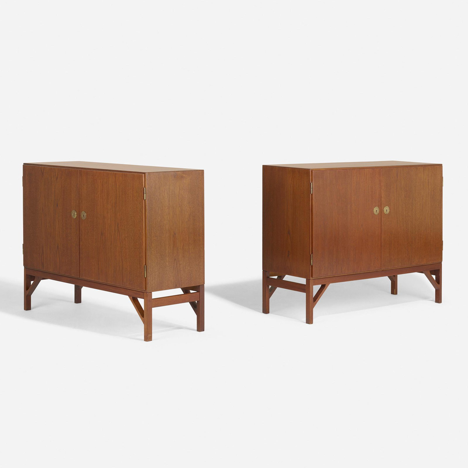 Borge Mogensen, cabinets, pair: Borge Mogensen cabinets, pair C.M. Madsens Fabrikker with Fredericia Denmark, c. 1945 / c. 1960 teak, brass 48 w × 18 d × 37 h in (122 × 46 × 94 cm) Each cabinet features two doors concealing