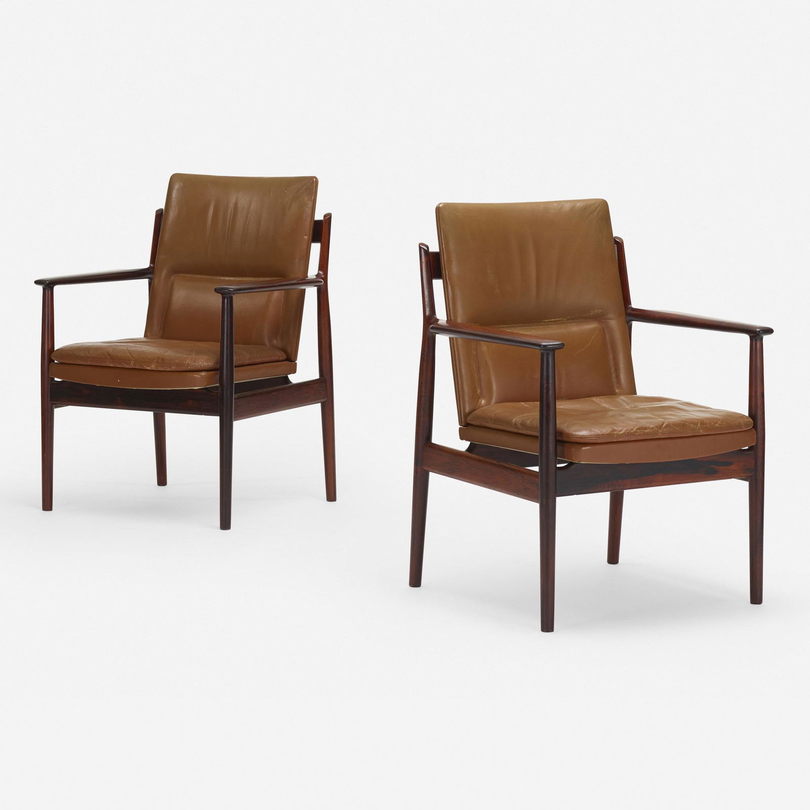 Arne Vodder, armchairs model 431, pair: Arne Vodder armchairs model 431, pair Sibast FurnitureDenmark, c. 1960rosewood, leather26.75 w × 25 d × 34.25 h in (68 × 63 × 87 cm) Foil manufacturer's label to underside of each example '