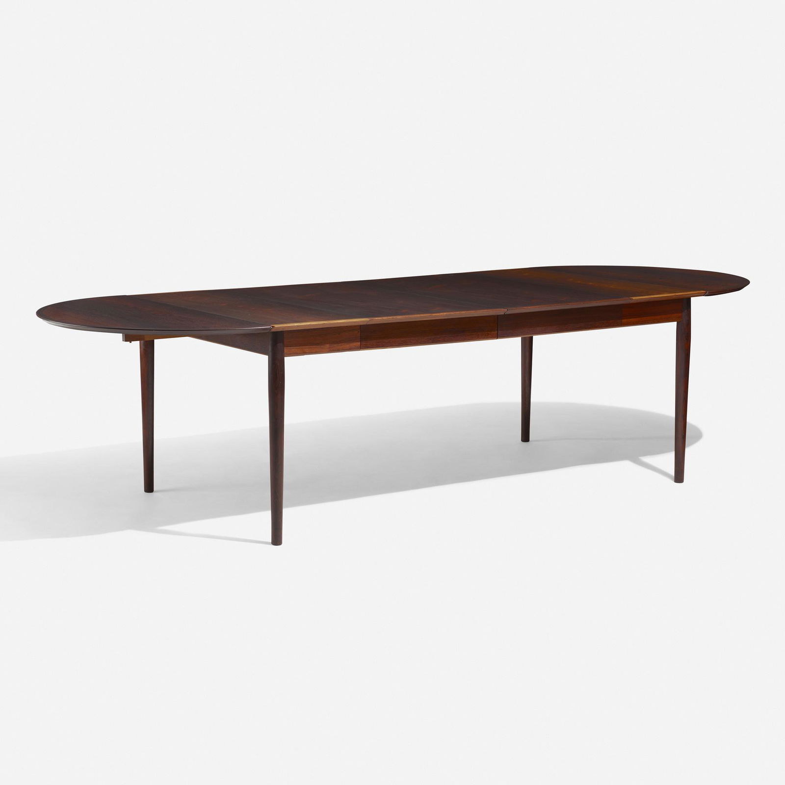 Arne Vodder, dining table: Arne Vodder dining table Sibast MoblerDenmark, c. 1960rosewood114 w × 41.75 d × 28.5 h in (290 × 106 × 72 cm) Sold with two 22-inch leaves and two drop-leaves; table measures 31 inches at i