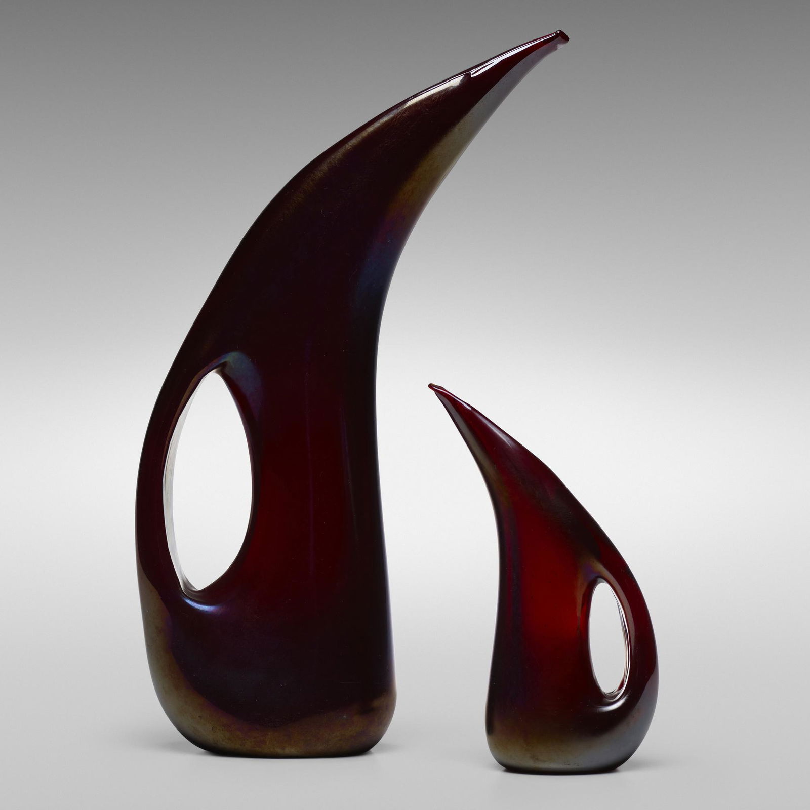 Giorgio Ferro, Anse Volante vases, set of two: Giorgio Ferro Anse Volante vases, set of two A.V.E.M.Italy, c. 1952iridized glass9 w × 3 d × 14.75 h in (23 × 8 × 37 cm) Additional example measures: 4.5 w x 2 d x 7