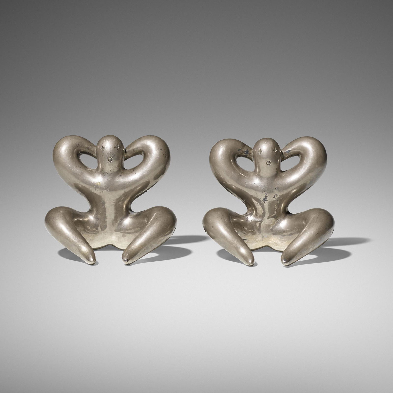 Russel Wright, Bobo bookends, pair: Russel Wright Bobo bookends, pair Russel Wright, Inc.USA, c. 1930chrome-plated brass5 w × 4.5 d × 4.5 h in (13 × 11 × 11 cm) Literature: The Coll