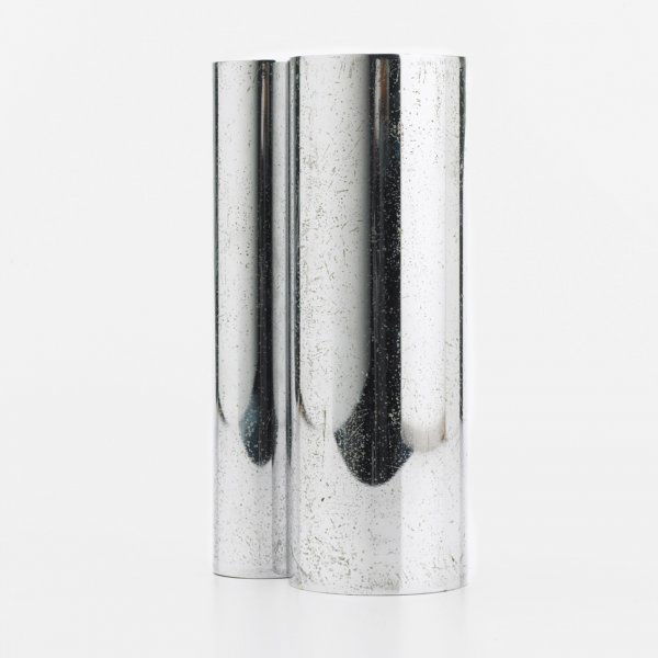Russel Wright double cylandier vase: Russel Wright double cylandier vase Russel Wright Inc. USA , 1930 chrome-plated steel 4.75 w x 3 d x 8.75 h inches Impressed signature to underside: [Russel Wright]. Literature: Collector's Encycloped