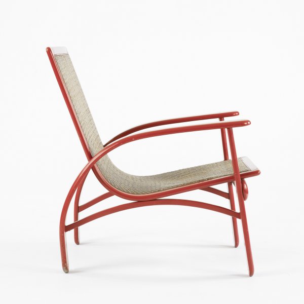 In The Manner Of Russel Wright lounge chair: In The Manner Of Russel Wright lounge chair USA, c. 1950 lacquered wood, cane 25 w x 29 d x 31.5 h inches