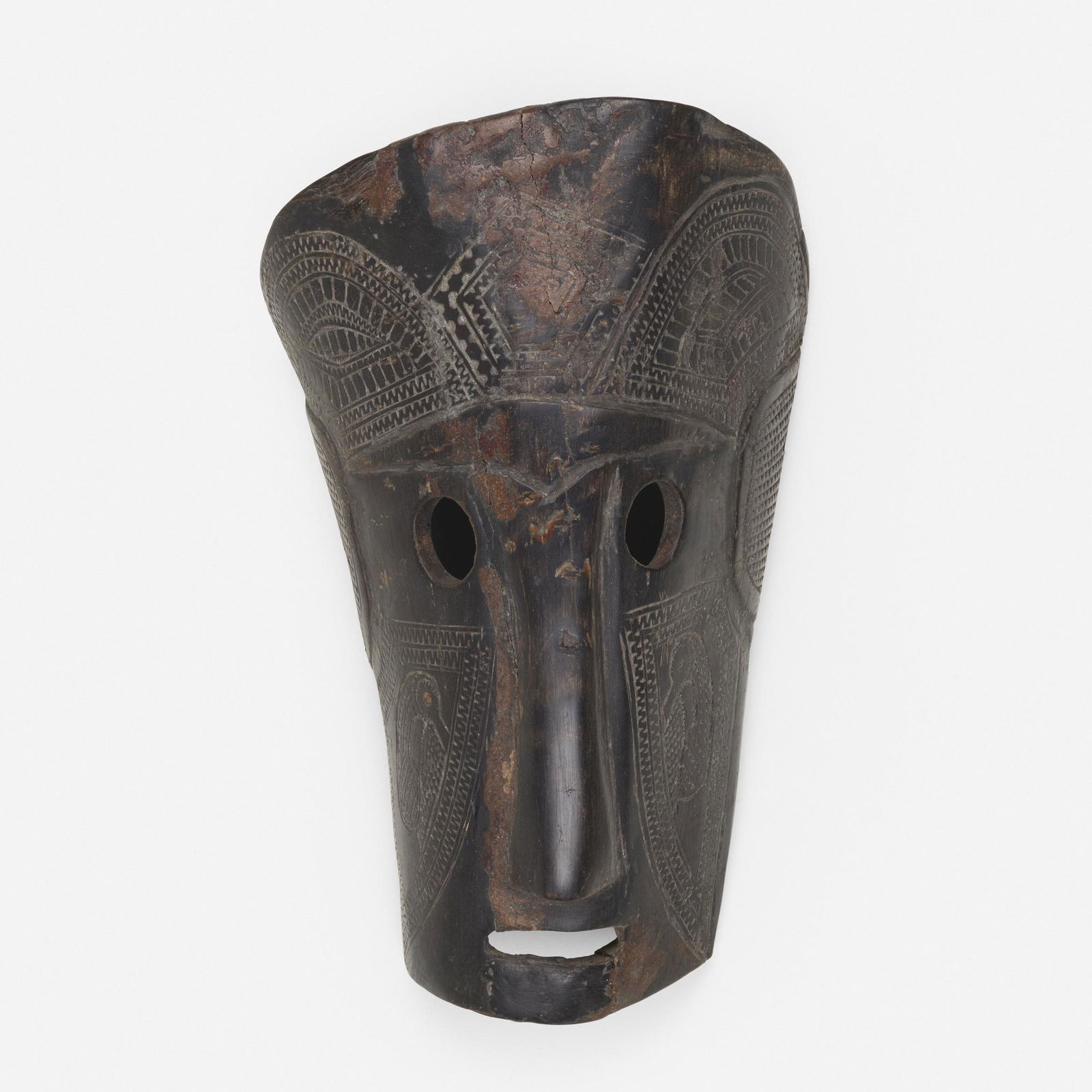 Oceanic, Mask: Oceanic Mask 20th centurycarved bone8.25 h × 5 w × 3.25 d in (21 × 13 × 8 cm) Provenance: Collection of Robert Wilson | Phillips, de Pury & Company, New Y