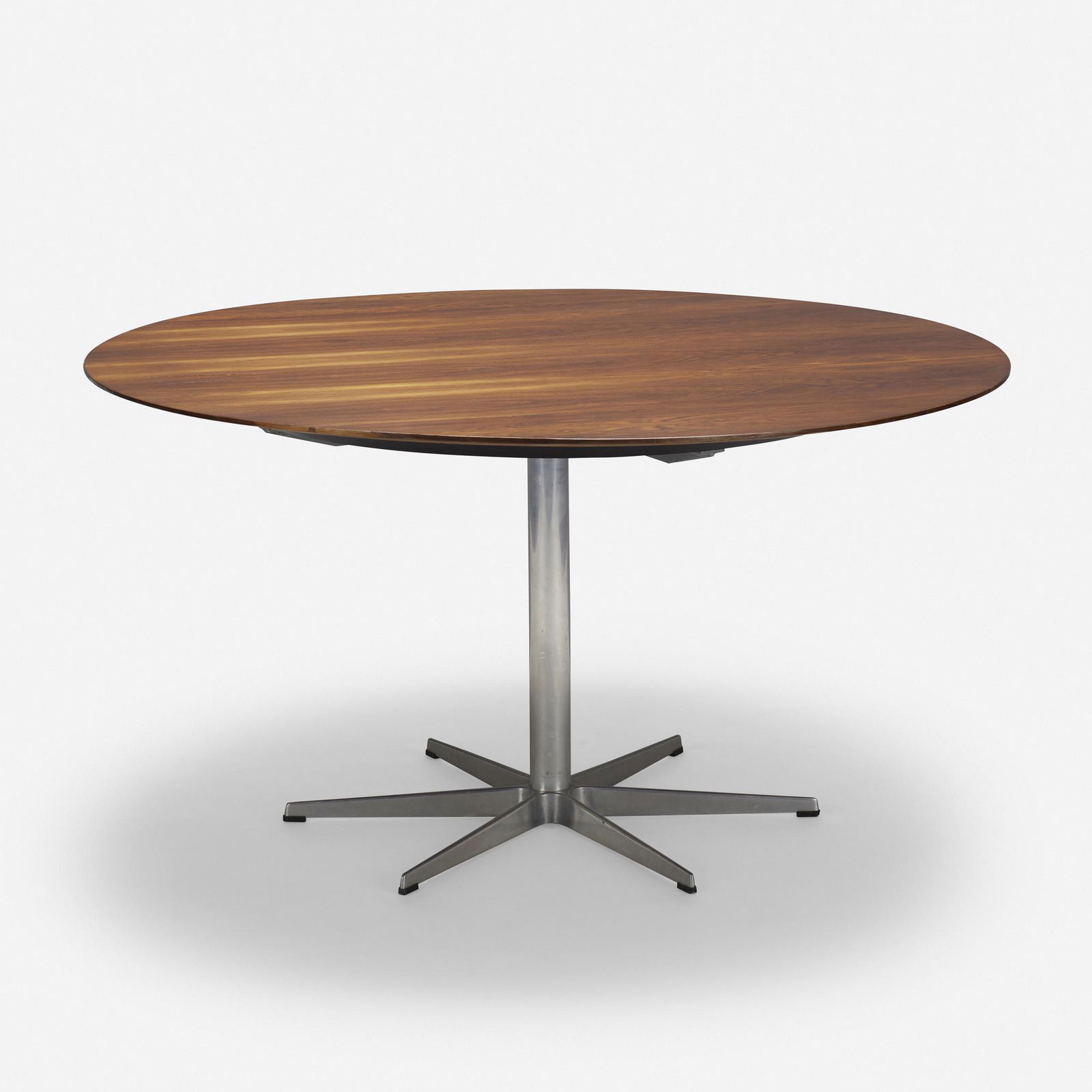 Arne Jacobsen and Bruno Mathsson, Circular dining table: Arne Jacobsen and Bruno Mathsson Circular dining table Fritz HansenDenmark, c. 1955rosewood, aluminum, lacquered wood, plastic 29 h × 55 dia in (74 × 140 cm)