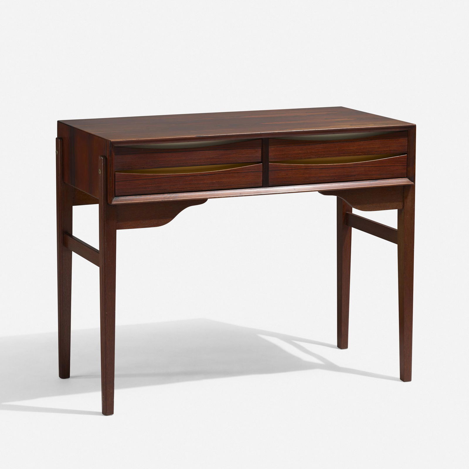 Arne Vodder, Desk: Arne Vodder Desk Sibast FurnitureDenmark, c. 1960rosewood, lacquered wood 30.75 h × 38 w × 19.25 d in (78 × 97 × 49 cm) Desk features four drawers. Applied decal