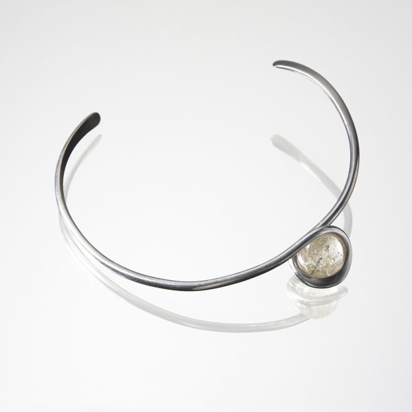 Art Smith Trapped-ball necklace: Art Smith Trapped-ball necklace USA, 1955-1972 sterling silver, quartz 4.25 w x .75 d x 4.5 h inches Impressed signature to reverse: [Art Smith]. Provenance: Acquired directly from the artist by Shirl