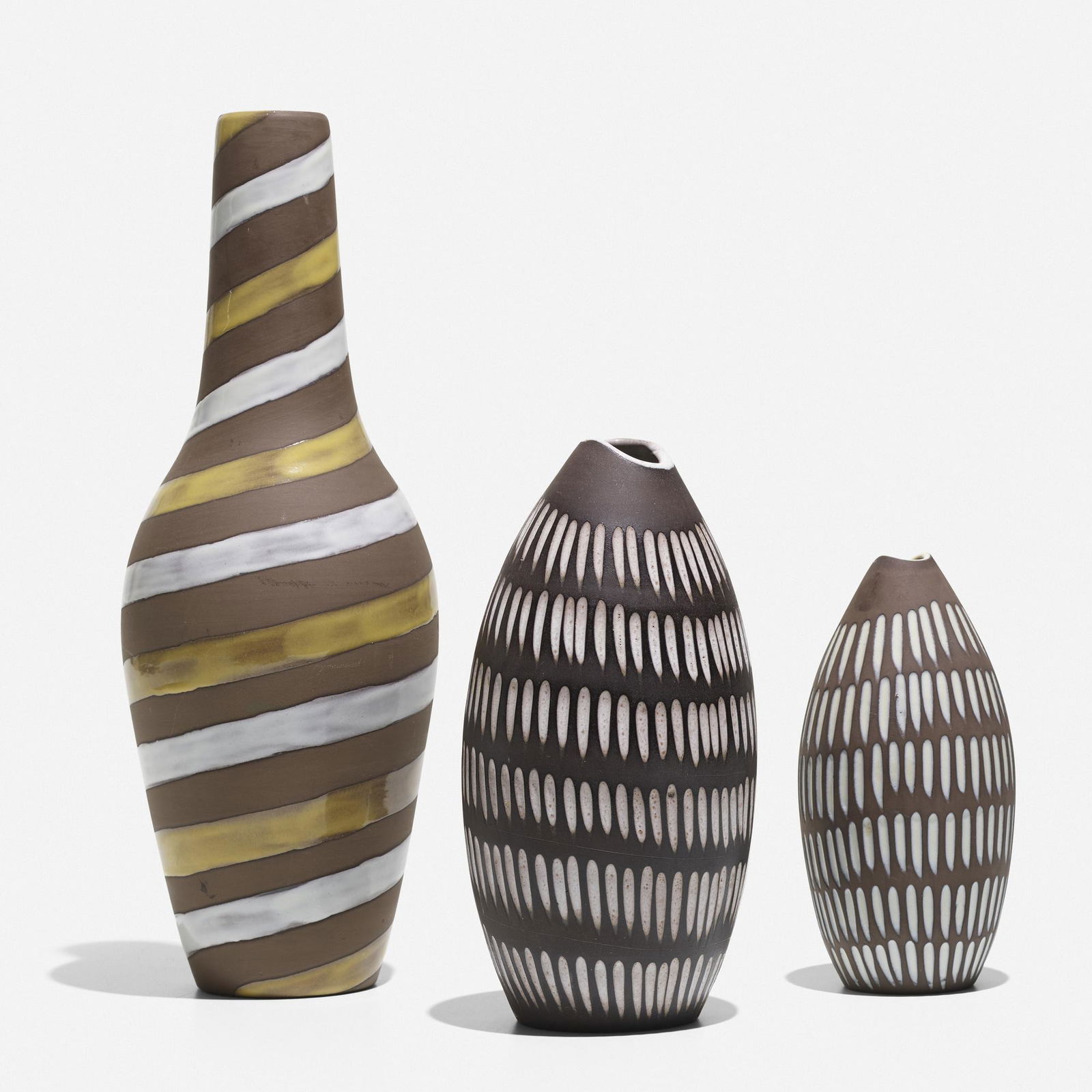 Upsala-Ekeby AB, Collection of three vases: Upsala-Ekeby AB Collection of three vases Sweden, c. 1955glazed stoneware largest: 14.5 h × 5 dia in (37 × 13 cm) smallest: 7 h × 3.5 dia in (18 × 9 cm) Impressed an