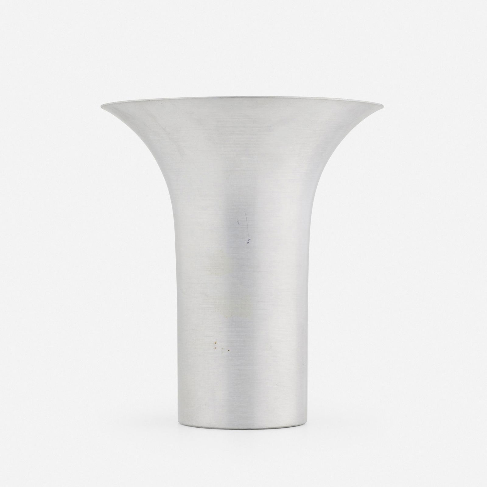 In the manner of Russel Wright, Flared vase: In the manner of Russel Wright Flared vase USA, c. 1940spun aluminum 10 h × 9 dia in (25 × 23 cm) Impressed manufacturer's mark to underside 'Yorkville'. This w