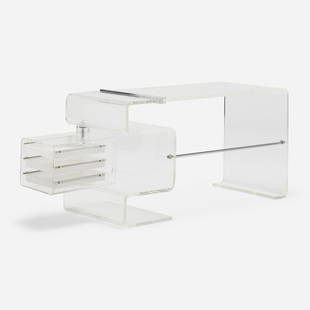 Michel Dumas, Desk: Michel Dumas Desk France, c. 1971Lucite, chrome-plated and stainless steel, acrylic 29.25 h × 55.25 w × 23.5 d in (74 × 140 × 60 cm) Desk features a rotating storage co