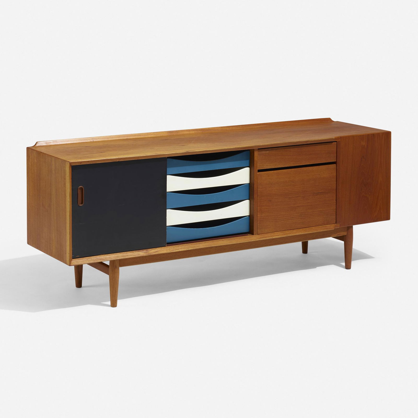 Arne Vodder, Cabinet: Arne Vodder Cabinet Sibast FurnitureDenmark, 1960teak, lacquered wood 25.25 h × 65.75 w × 16.5 d in (64 × 167 × 42 cm) Cabinet features one sliding door concealin