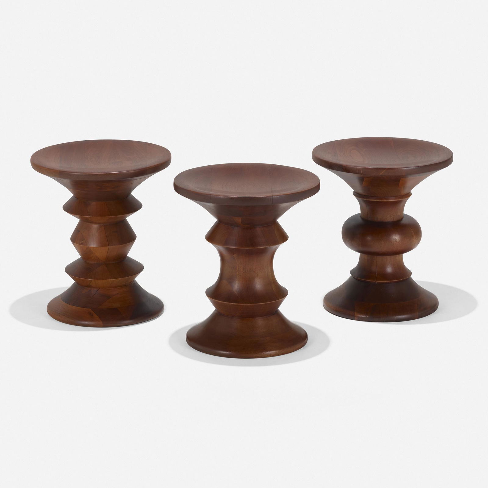Charles and Ray Eames, Time Life stools, set of three: Charles and Ray Eames Time Life stools, set of three Herman MillerUSA, 1960walnut 15 h × 13 dia in (38 × 33 cm) Literature: Eames Design: The Work of the