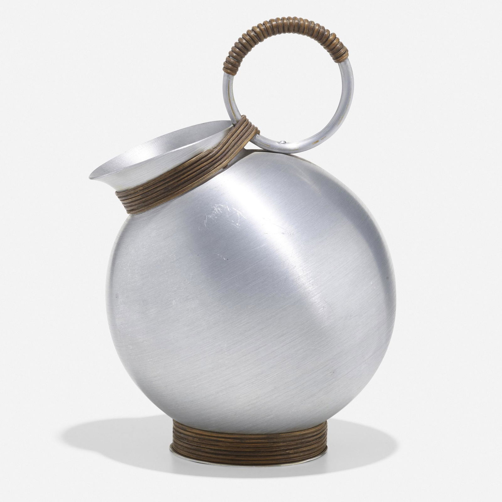Russel Wright, Rare Sherry pitcher: Russel Wright Rare Sherry pitcher USA, c. 1935spun aluminum, rattan 10.5 h × 6.5 w × 7 d in (27 × 17 × 18 cm) Literature: Collector's Encyclopedia o