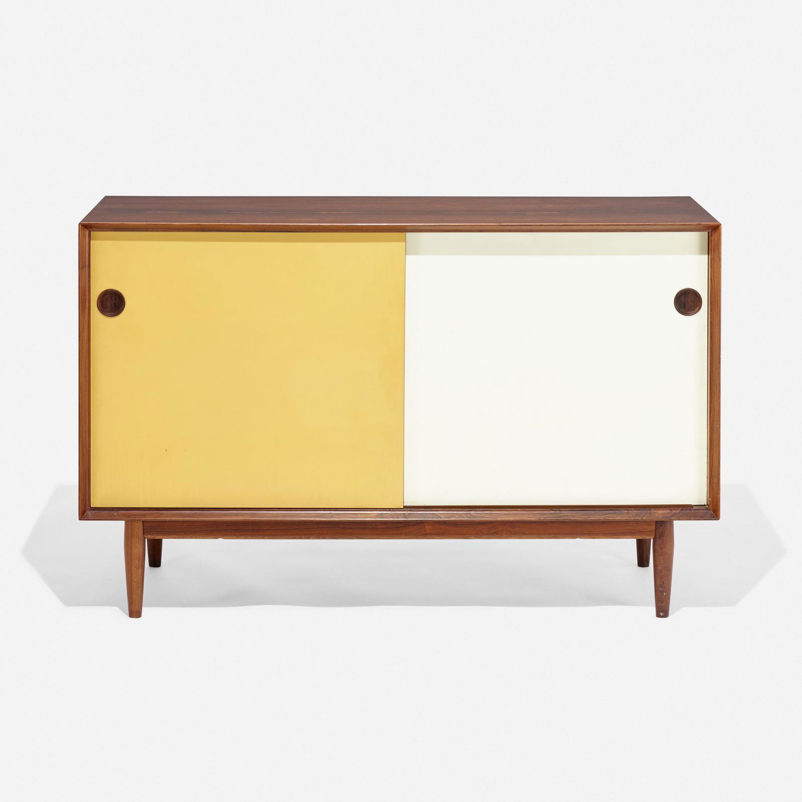 Arne Vodder, Cabinet: Arne Vodder Cabinet Sibast MoblerDenmark, c. 1960rosewood, lacquered masonite 32 h × 49.5 w × 19.5 d in (81 × 126 × 50 cm) Cabinet features two reversible sliding