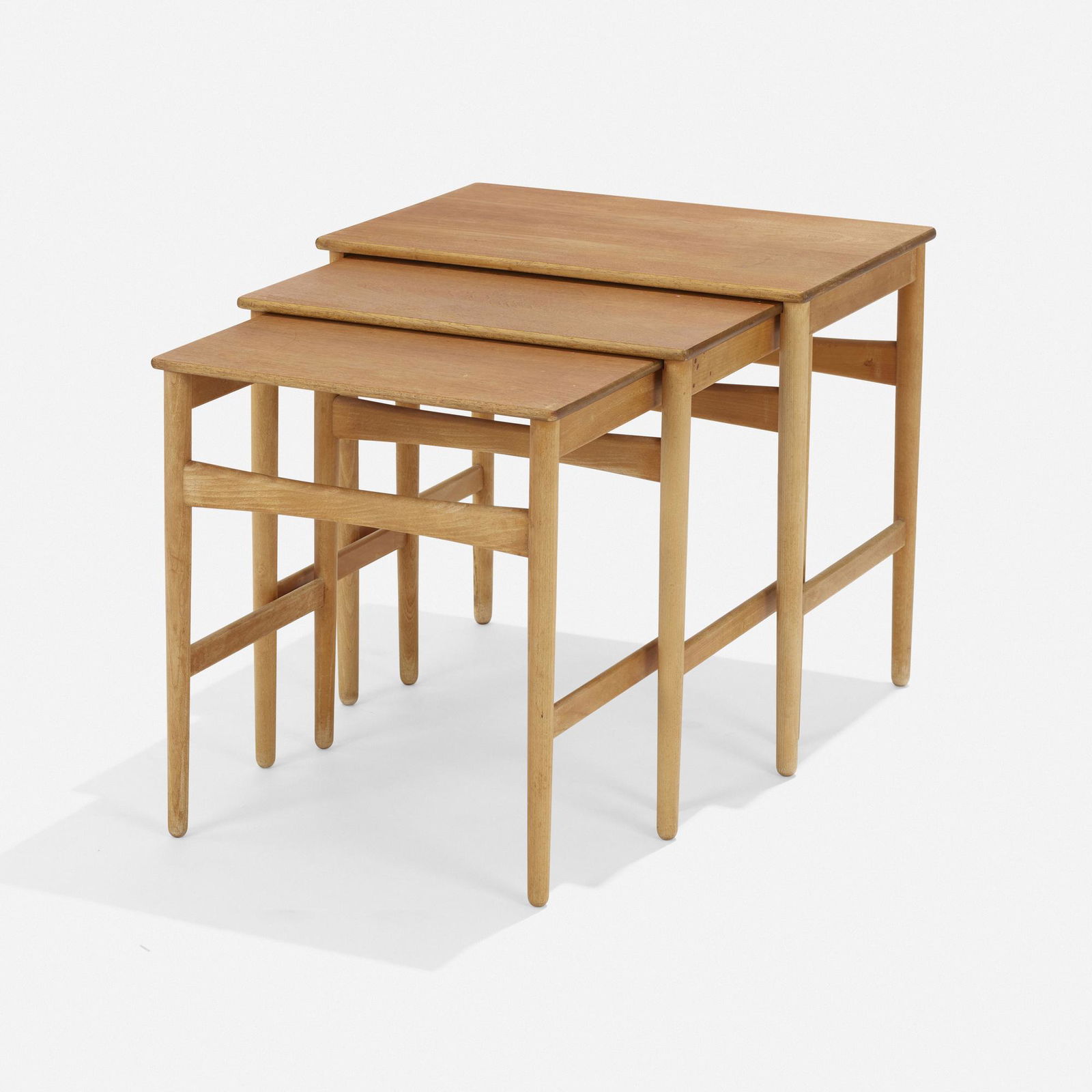 Hans J. Wegner, Nesting tables, set of three: Hans J. Wegner Nesting tables model AT 40, set of three Andreas TuckDenmark, c. 1950teak, beech 19 h × 20.5 w × 13.25 d in (48 × 52 × 34 cm) 18.25 h × 18 w &tim