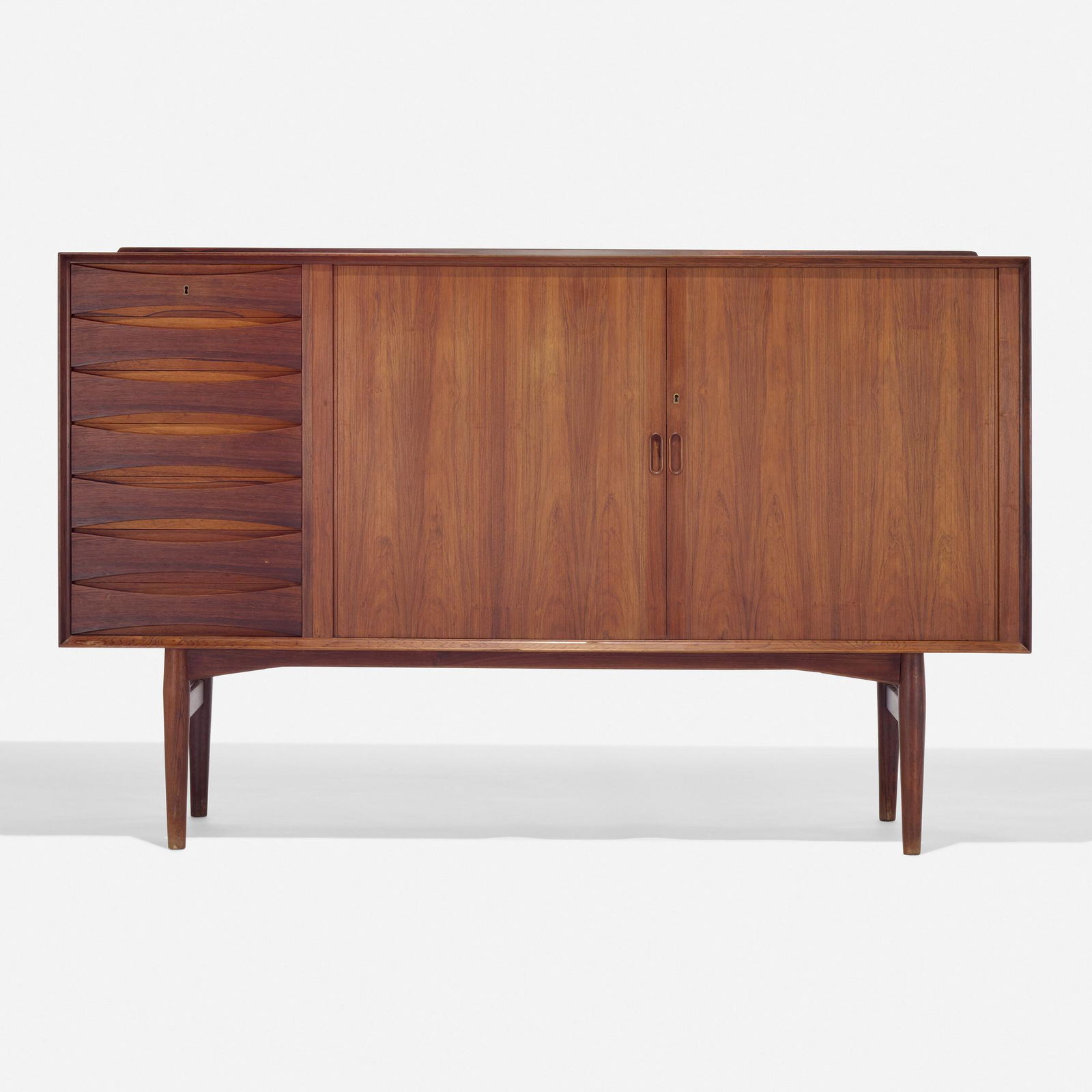 Arne Vodder, Cabinet: Arne Vodder Cabinet Sibast MoblerDenmark, c. 1960rosewood 44.5 h × 71.75 w × 19.5 d in (113 × 182 × 50 cm) Cabinet features seven drawers and two sliding doors co