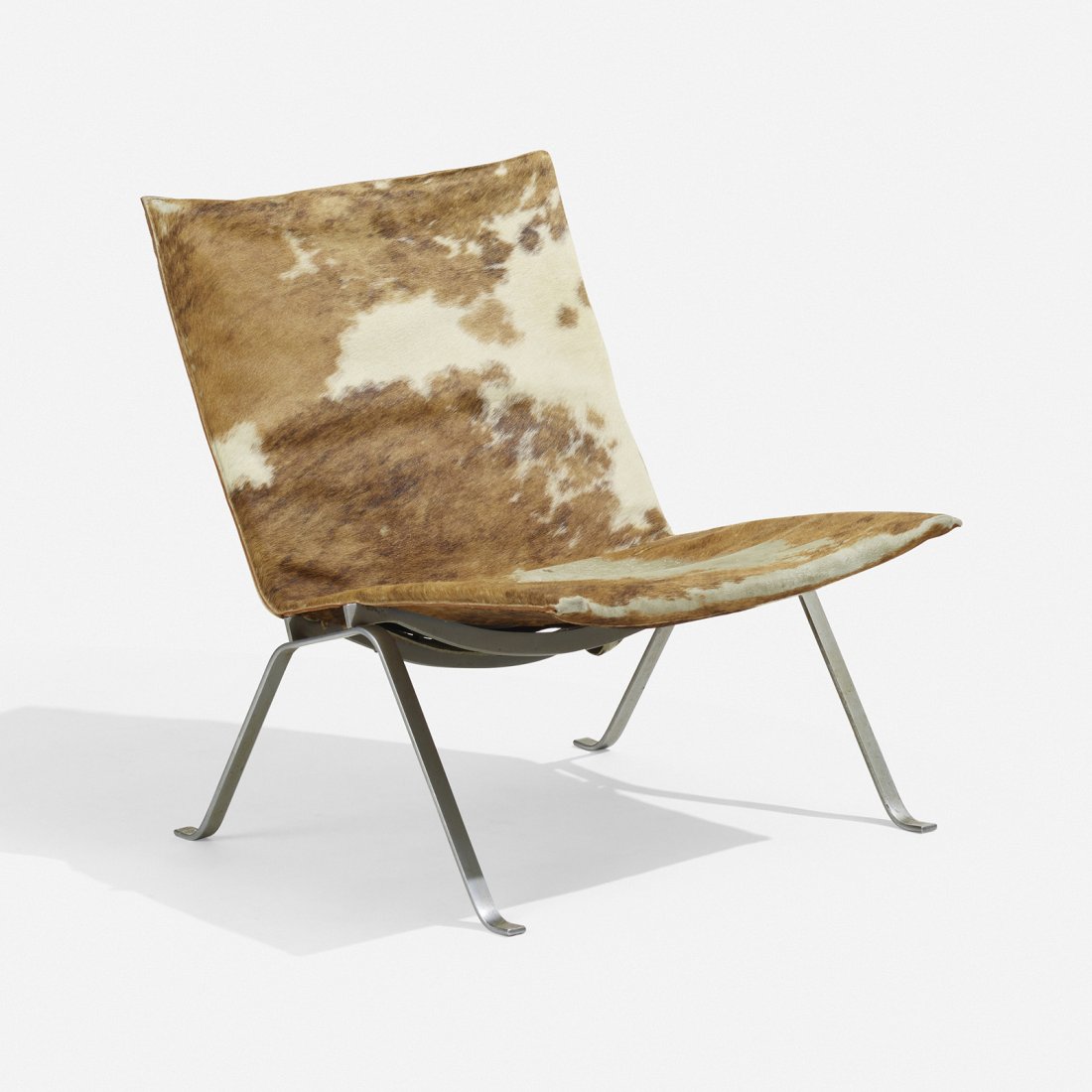 After Poul Kjaerholm, Lounge chair: After Poul Kjaerholm Lounge chair Denmark, c. 1955 cowhide, matte chrome-plated steel 28 h Ã— 24.75 w Ã— 27 d in (71 Ã— 63 Ã— 69 cm) This work will ship from Wright in Chic