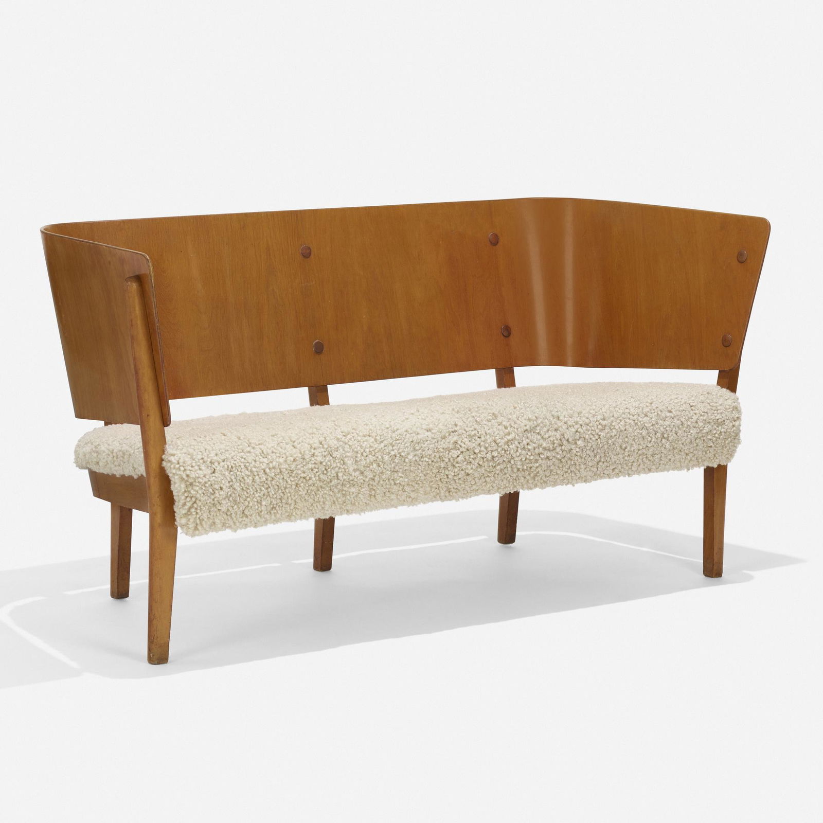 Soren Hansen, Sofa, model 2240: Soren Hansen Sofa, model 2240 Fritz HansenDenmark, 1939teak, faux sheepskin 29.5 h × 59.75 w × 25 d in (75 × 152 × 63 cm) This work will ship from Wr