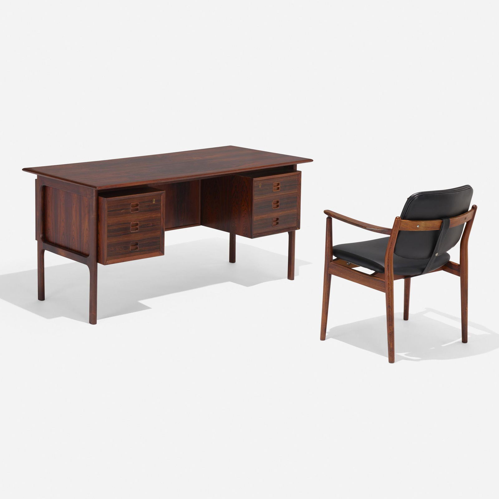 Arne Vodder, Desk and chair: Arne Vodder Desk and chair Sibast MoblerDenmark, c. 1960rosewood, leather desk: 28.5 h × 56.5 w × 29 d in (72 × 144 × 74 cm) chair: 31 h × 24 w × 23 d in