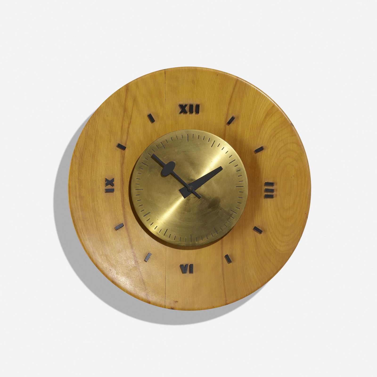George Nelson & Associates, Wall clock, model 4757B: George Nelson & Associates Wall clock, model 4757B Howard Miller Clock CompanyUSA, 1949birch, brass, enameled brass 3.5 d × 14 dia in (9 × 36 cm) Decal manufacturer's label t