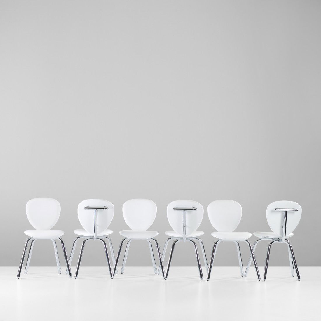 Marc Newson Sine chairs, set of six: Marc Newson Sine chairs, set of six Cappellini Australia, 1989 leather, chrome-plated steel 21 w x 20 d x 30 h inches Signed with manufacturer's decal label to underside of each example: [Cappellini M