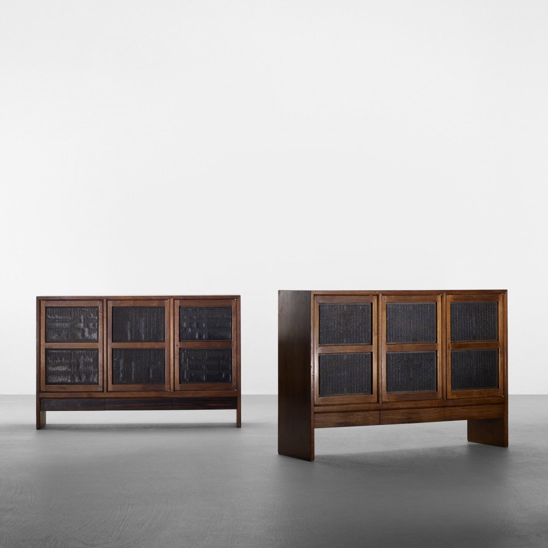 Edward Wormley Chinese block cabinets, pair: Edward Wormley Chinese block cabinets, pair Dunbar USA, c. 1957 walnut, lacquered wood, rosewood, brass 49.5 w x 13.5 d x 34 h inches Cabinets each features three drawers and three doors concealing on