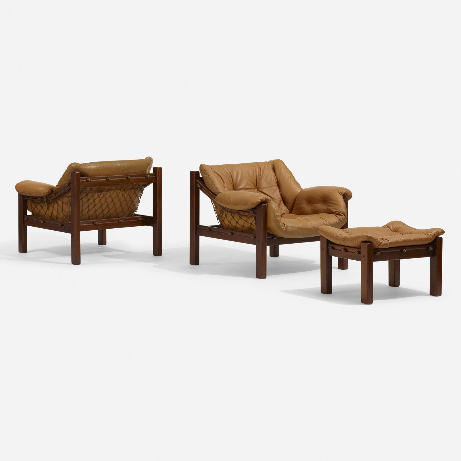Jean Gillon, Amazonas lounge chairs, pair and ottoman: Jean Gillon Amazonas lounge chairs, pair and ottoman Italma Wood ArtBrazil, c. 1965teak, leather, cording chair: 30.25 h × 38 w × 37 d in (77 × 97 × 94 cm) ottoman: 1