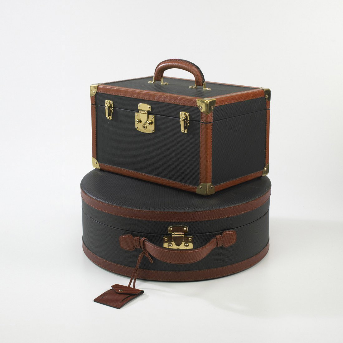 Bottega Veneta hat and train case: Bottega Veneta hat and train case Italy, c. 1975 embossed leather, brass 17 w x 6 d x 19 h inches Train case measures: 14 w x 9 d x 11 h inches. Signed to interiors: [Bottega Veneta Made in Italy] wit