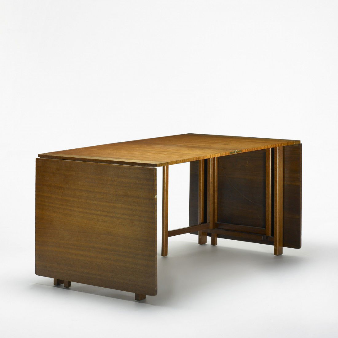 Bruno Mathsson, attribution folding table: Bruno Mathsson, attribution folding table Sweden, c. 1970 ribbon mahogany, teak 115 w x 36 d x 30 h inches Table features four 27.25-inch leaves and can be arranged in a variety of configurations; tab
