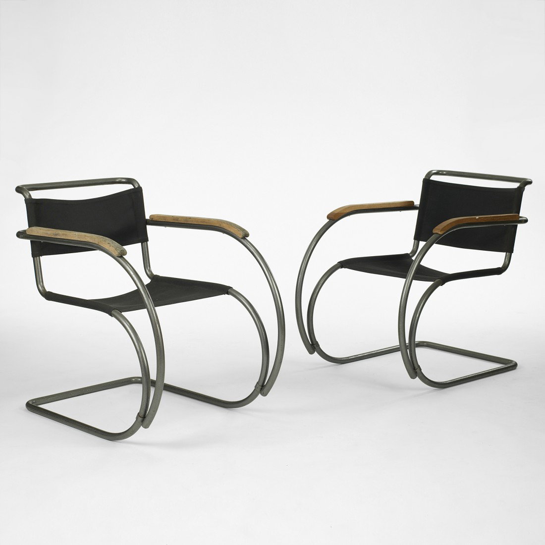 Ludwig Mies van der Rohe MR20 lounge chairs, pair: Ludwig Mies van der Rohe MR20 lounge chairs, pair Thonet Germany, 1927/c. 1955 enameled tubular steel, oak, Eisengarn 22 w x 33 d x 30.5 h inches Literature: Thonet, 1934, manufacturer's catalogue, un