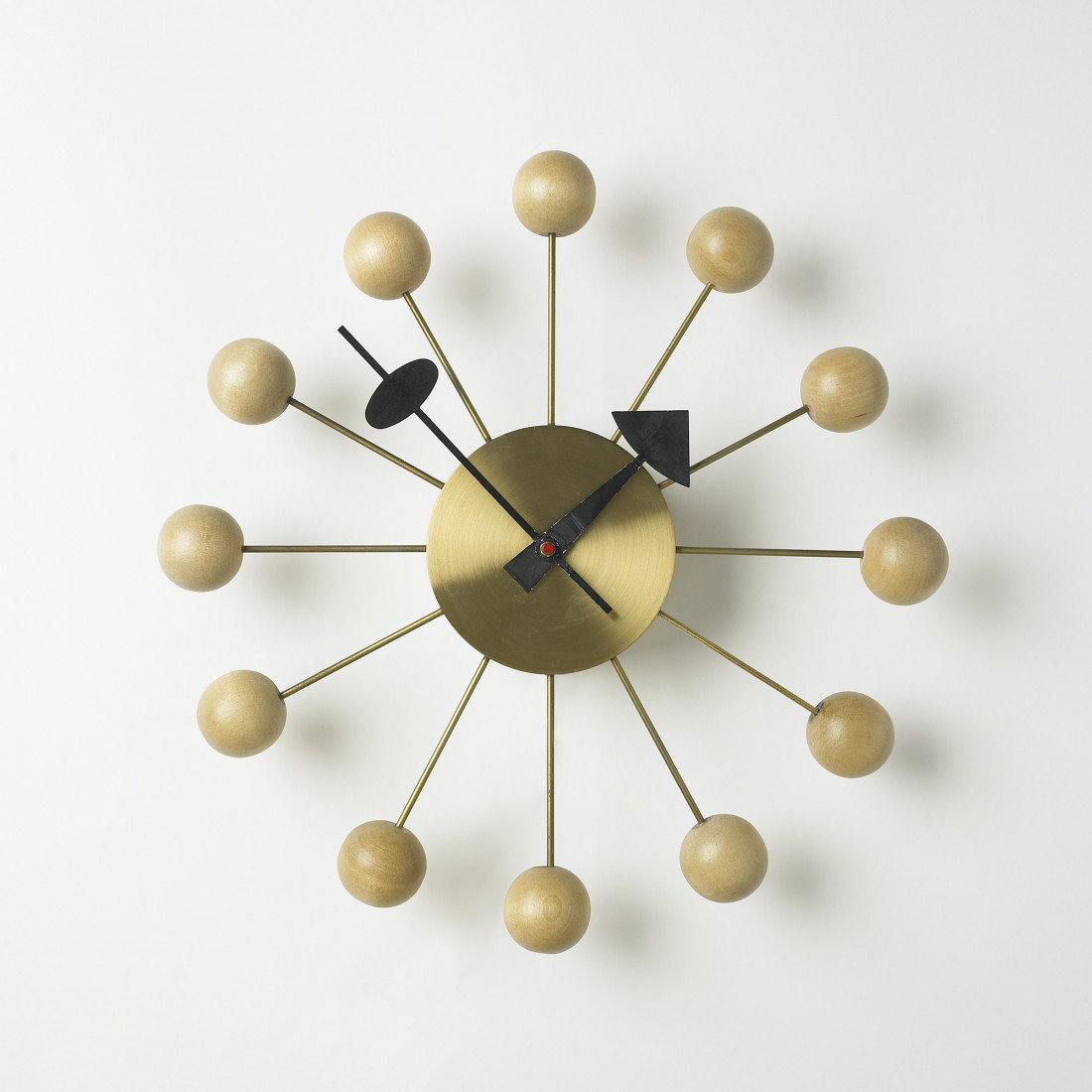 George Nelson & Associates Ball wall clock: George Nelson & Associates Ball wall clock, model 4755 Howard Miller Clock Company USA, 1949 brass, birch, enameled aluminum 13 dia x 9 h inches Signed with stamped manufacturer's mark to reverse: [47