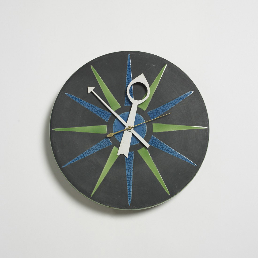 George Nelson & Associates Meridian wall clock: George Nelson & Associates Meridian wall clock, model 7546 Howard Miller/Meridian USA, c. 1955 glazed stoneware, enameled aluminum, brass 13 w x 3 d x 13 h inches Signed with partial decal manufacture
