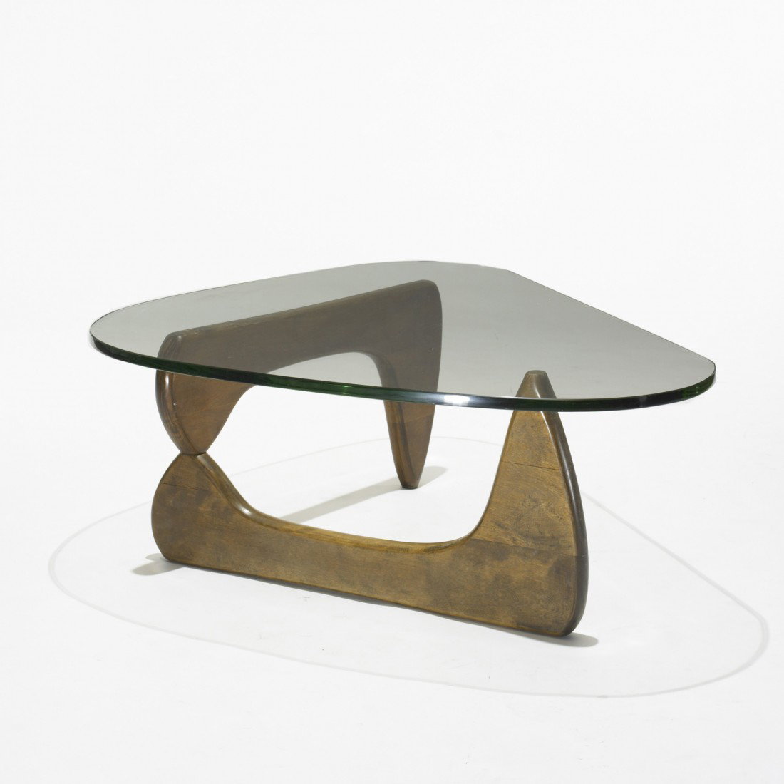 Isamu Noguchi coffee table, model IN-50: Isamu Noguchi coffee table, model IN-50 USA, 1944 walnut, glass 50 w x 36 d x 15 h inches Literature: Isamu Noguchi: Sculptural Design, Eisenbrand, Posch and von Vegesack, pg. 118 The Herman Miller Co