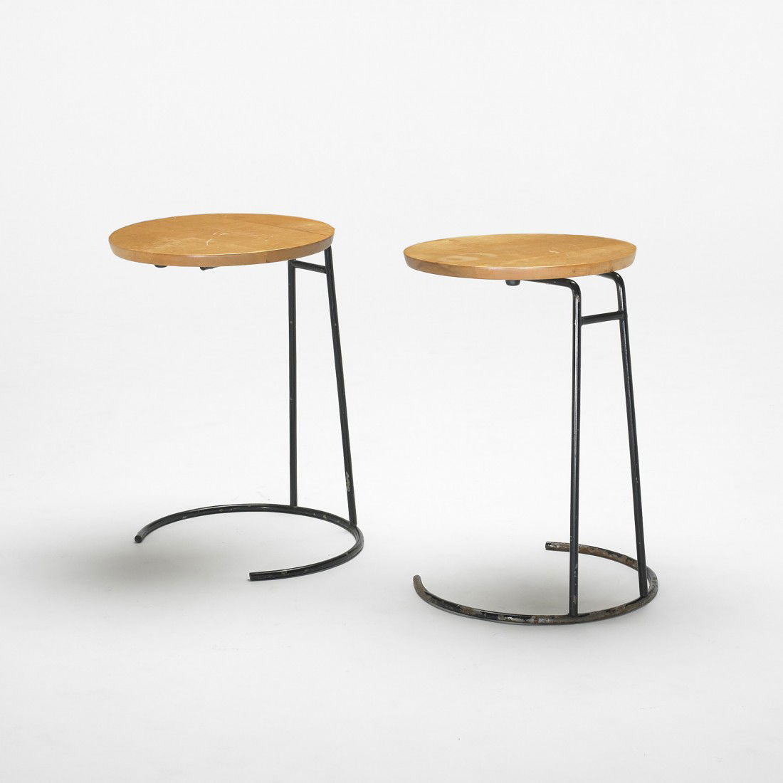 Jens Risom occasional tables, pair: Jens Risom occasional tables, pair Jens Risom Designs, Inc. Denmark, c. 1960 birch, enameled steel 15 dia x 20.5 h inches Signed with partial decal manufacturer's label to underside of one example: [J
