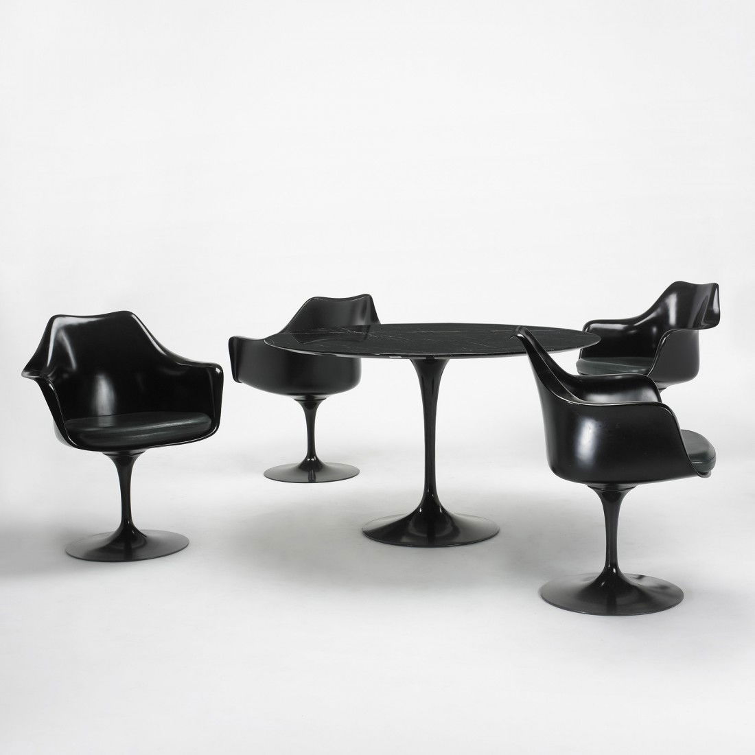 Eero Saarinen Tulip dining set: Eero Saarinen Tulip dining set Knoll USA, 1956 enameled aluminum, plastic, marble, vinyl 47 dia x 28.5 h inches Set includes table and four chairs; chairs measure: 26.25 w x 23 d x 32 h inches. Signed