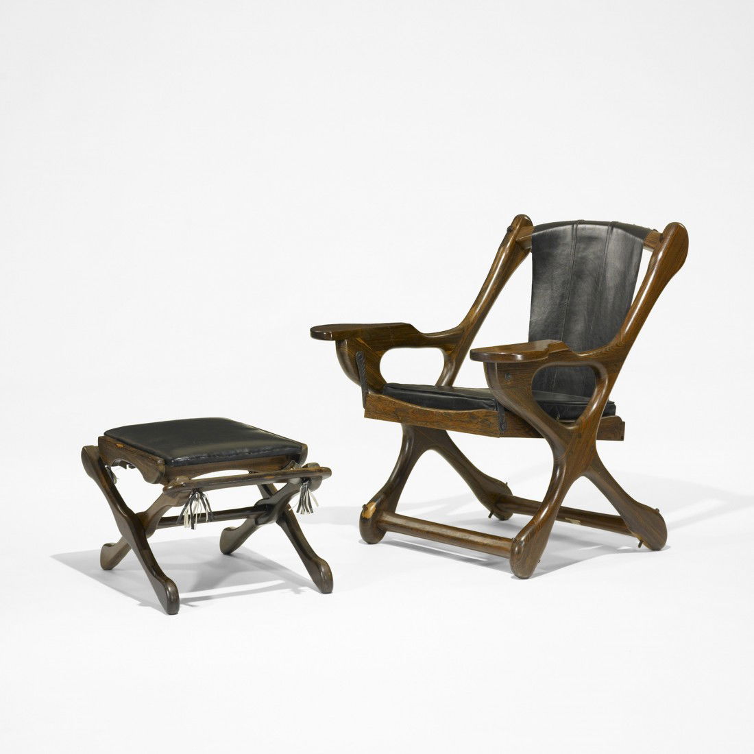Don Shoemaker lounge chair and ottoman: Don Shoemaker lounge chair and ottoman Señal Mexico, c. 1970 rosewood, leather 30.5 w x 29 d x 32.5 h inches Ottoman measures: 22.5 w x 16.5 d x 14 h inches.