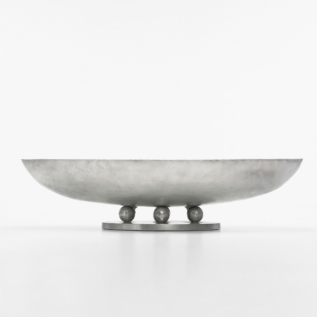 Palmer Smith centerpiece: Palmer Smith centerpiece USA, c. 1935 hand-hammered aluminum 22.5 w x 8.5 d x 5.5 h inches Signed with impressed manufacturer's mark to underside: [Palmer Smith 173].