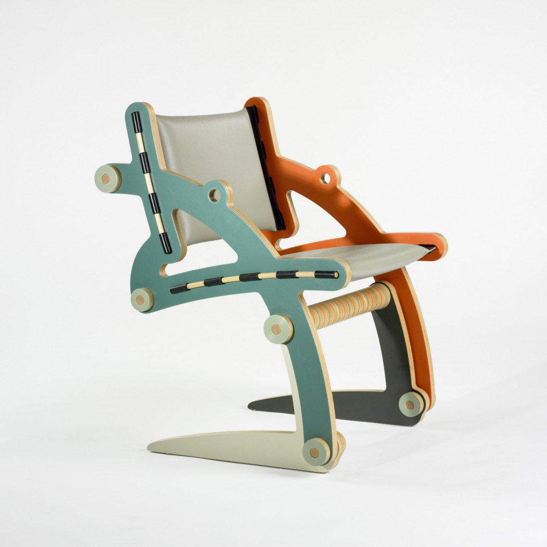 Kenneth Smythe IRENKE V SQ BK chair: Kenneth Smythe IRENKE V SQ BK chair USA, 2001 finn birch laminate, reprocessed formica colorcore, leather, Sunbrella acrylic, 26 w x 27 d x 35 h inches This is a unique work.