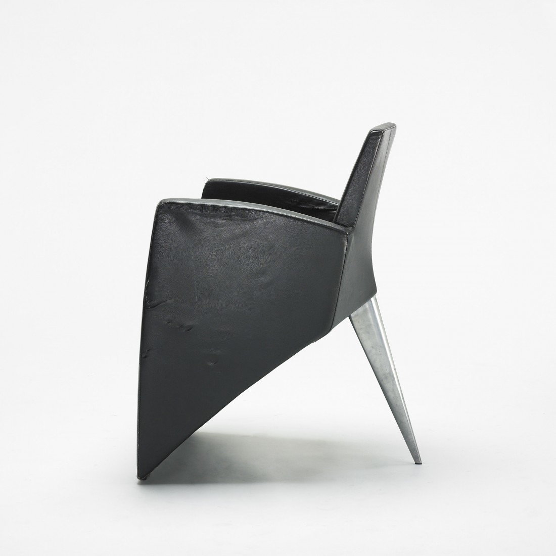 Philippe Starck J. (Série Lang) lounge chair: Philippe Starck J. (Série Lang) lounge chair France, 1987 leather, cast aluminum 24 w x 27 d x 33.5 h inches This chair was designed for the Royalton Hotel, New York but was not selected for the comm